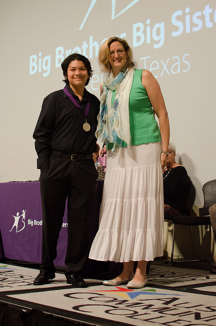 Little Brother receives his scholarship Promise medal.